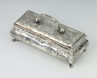 A Continental white metal repousse casket with swing handle and extensive scenes of revellers, raised on pad feet 13.5cm, 144gms 