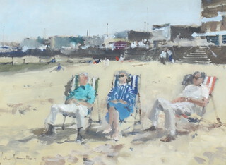 ** John Yardley born 1933, oil on board, beach scene with figures and deckchairs and distant buildings 20cm x 28cm **PLEASE NOTE - Works by this artist may be subject to Artist's Resale Rights 
