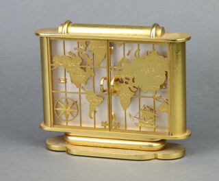 St Blaise, a 1950's Swiss timepiece with rectangular silvered dial and gilt batons, contained in a gilt case enclosed by a pair of pierced doors decorated a map 13cm x 15cm x 5cm 