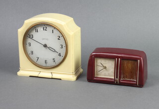 Estyma, a 1950's travelling alarm clock with square paper dial, Arabic numerals, contained in a red Bakelite arched case 7cm x 12cm x 5cm, fitted a musical box, together with a Smiths Art Deco timepiece with silvered dial, Roman numerals, contained in a white Bakelite case 13cm x 14cm d x 6cm (winder missing to the back)  