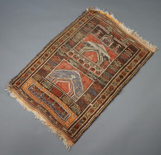 An orange and brown ground Afghan rug 128cm x 86cm 