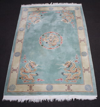 A green and cream ground Chinese rug with dragon medallion to the centre 282cm x 185cm 