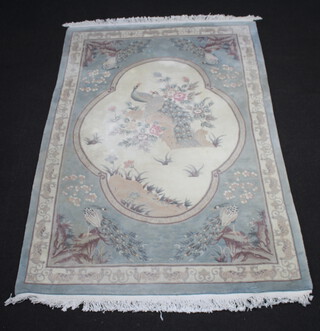 A blue and white ground Chinese rug decorated birds 280cm x 181cm 