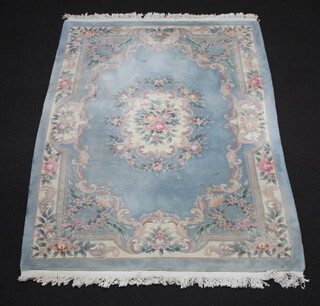 A blue and white floral patterned Chinese rug 247cm x 172cm  