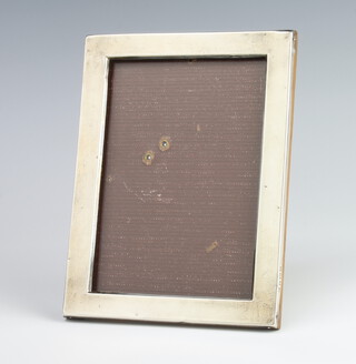 A rectangular silver photograph frame, Birmingham 1915, 16.5cm x 12cm