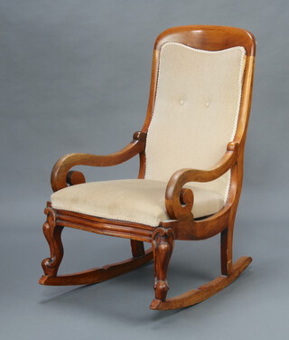A Victorian mahogany show frame rocking chair upholstered in mushroom coloured material, 98cm h x 76cm w x 50cm d 
