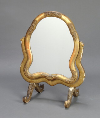 An Italian style shaped plate dressing table mirror contained in a decorative gilt frame 61cm x 47cm x 31cm 