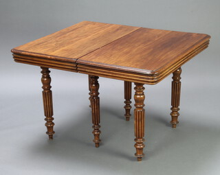 A 19th Century Continental D shaped mahogany extending dining table with 2 extra leaves, raised on 6 turned and reeded supports 74cm h x 100cm w x 102cm l x 197cm l with the leaves  