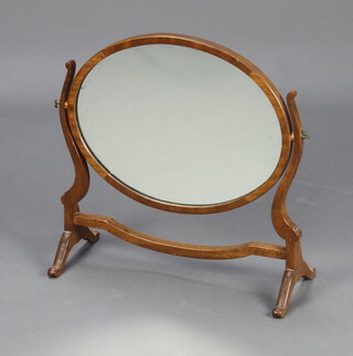 A 19th Century style oval plate dressing table mirror contained in a mahogany swing frame 50cm h x 48cm w x 21cm d 