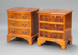 A pair of Georgian style yew bedside chests of serpentine outline with canted corners fitted 3 drawers, raised on bracket feet 59cm h x 50cm w x 39cm d 