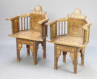 A pair of heavily inlaid mother of pearl Moorish armchairs with spindle decoration  88cm h x 61cm w x 47cm d 