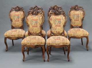 A set of 6 Victorian carved and pierced walnut high back dining chairs with over stuffed seats, raised on French cabriole supports 100cm h x 47cm w x 40cm d (seats 24cm x 26cm)