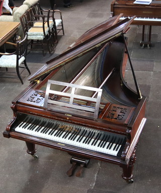 John Broadwood and Sons of London, a mid Victorian rosewood cased, iron framed straight strung grand piano, stamped WJ 20831, raised on 3 octagonal turned supports 98cm h x 256cm l x 142cm w