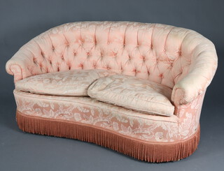 A 1940's crescent shaped sofa with buttoned pink material 75cm h x 157cm w x 86cm d, inside seat 117cm w x 86cm d