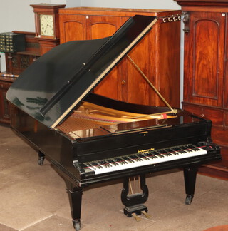 John Broadwood and Sons London, an iron framed overstrung concert grand piano in an ebonised case, the underside marked 54296 102cm h x 266cm l x 158cm w 
