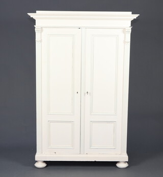 A 19th Century French white painted oak press cabinet with moulded cornice, fitted 6 shallow trays enclosed by a panelled door, raised on bun supports 170cm h x 115cm w x 67cm d 