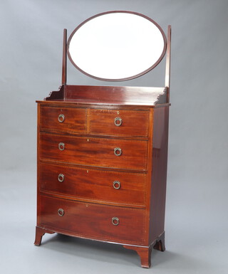 An Edwardian inlaid mahogany bow front dressing chest with oval bevelled plate mirror and 3/4 gallery, the base fitted 2 short and 3 long drawers, raised on splayed bracket feet 195cm h x 100cm w x 49cm d 