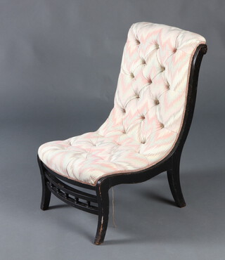 A Victorian ebonised nursing chair upholstered in buttoned material, raised on outswept supports 72cm h x 42cm w x 48cm d (seat 27cm x 22cm)