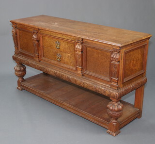 A 17th Century style Continental carved oak sideboard fitted 2 drawers flanked by cupboards above pot board with cup and cover supports 90cm h x 162cm w x 51cm d  