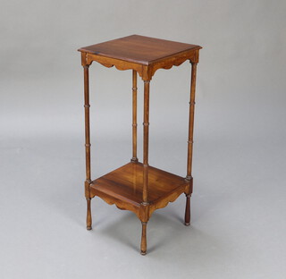 An Edwardian Chippendale style 2 tier urn table raised on turned supports 70cm x 30cm x 30cm 