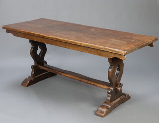 A 17th Century style elm refectory dining table raised on pierced standard end supports with H framed stretcher 78cm h x 71cm w x 180cm l 