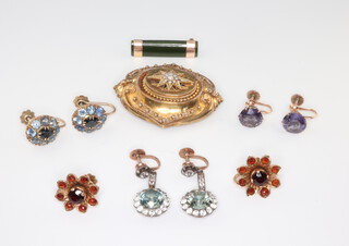A Victorian yellow metal enamelled and seed pearl etruscan brooch, 4 pairs of ditto earrings and a brooch 