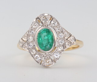 A Victorian style yellow metal 18ct emerald and diamond cluster ring, the centre stone 0.70ct, the brilliant cut diamonds 0.45ct, 3.2 grams, size N 1/2