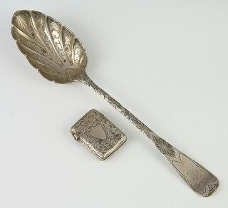 A Victorian silver berry spoon London 1854 together with a Victorian silver vesta Birmingham 1876, 78 grams 