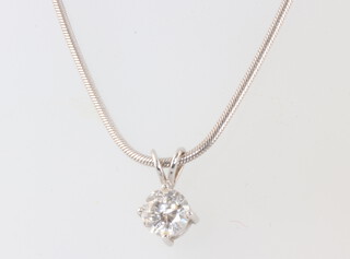 A single stone brilliant cut diamond pendant in a white metal mount, approx 0.75ct, on a 44cm 9ct white gold chain 