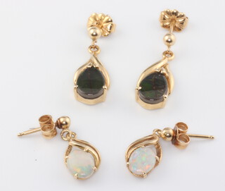 A pair of yellow metal 14k opal ear studs, a pair of ditto ammolite 4.7 grams