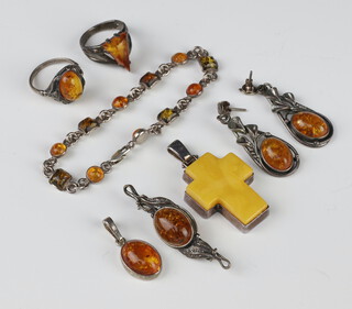 A silver amberoid pendant/brooch, a pair of earrings, pendant and 2 rings