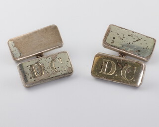 A pair of silver cufflinks engraved DC, 21 grams