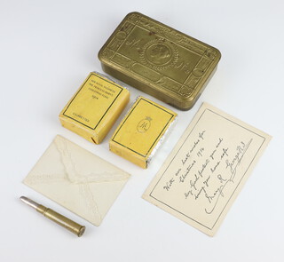 A Queen Mary 1914 Christmas tin containing card, tobacco, cigarettes, bullet pencil, together with a facsimile signed postcard 