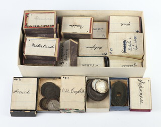 An interesting collection of world coins contained in labelled matchboxes (19) 