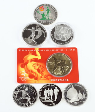 Six silver Olympic commemorative coins and 1 other