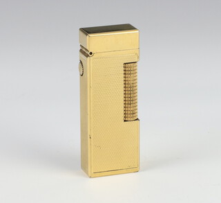 A gentleman's Dunhill gold plated engine turned cigarette lighter, boxed