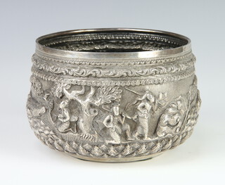 An Indian white metal repousse bowl decorated with a band of figures in a townscape 334 grams, 13cm 