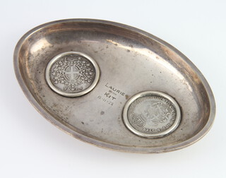 A Continental white metal double coin set oval dish 112 grams, 14.5cm 