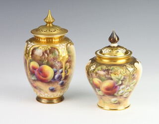 A Royal Worcester oviform vase decorated with fruits indistinctly signed with a reticulated lid (stuck) 16cm, together with a similar ditto 14cm 