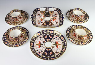 A Royal Crown Derby Imari pattern part tea set comprising 4 tea cups, 4 saucers, 4 small plates, a sandwich plate, a circular plate, 2 egg cups 