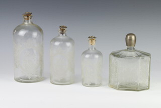 An etched bottle decorated with flowers having a metal stopper 19cm, a ditto 17cm, another 14cm and an octagonal ditto 15cm 