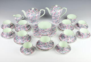 A Shelley Summer Glory part tea and coffee set comprising teapot, coffee pot, sugar bowl (cracked), cream jug, 6 small cups, 6 saucers, 5 large cups, 6 saucers, 5 small plates and a sandwich plate 