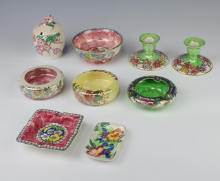 A Maling preserve jar and cover decorated with flowers 12cm, pair of dwarf candlesticks, 4 ashtrays and a dish 