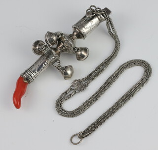 A 19th Century white metal rattle, teether and whistle with engraved decoration having a coral end 14cm on a white metal chain 