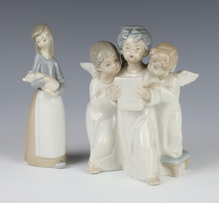 A Lladro group of 3 singing angels 18cm, a ditto of a girl carrying a piglet 16cm 