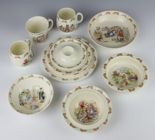 A Royal Doulton Bunnykins egg holder 14cm, 2 small plates, 2 medium plates, 3 bowls, 3 mugs and a baby's bowl 