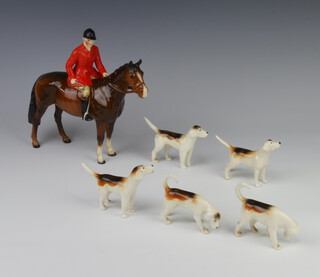 A Beswick figure - Huntsman model no.1501, brown gloss, 21cm, modelled by Arthur Gredington together with 5 fox hounds 6cm (1 stuck tail) 