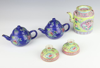 Two Chinese blue glazed teapots with floral decoration 10cm, a famille rose teapot decorated with birds with character mark to base 11cm (chipped, handles and lid) together with 2 cup covers (chipped) 