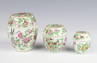 A set of 3 famille rose ovoid boxes and covers decorated with flowers and birds 5.5cm, 7cm and 9.5cm 
