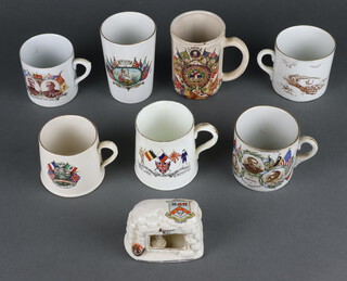 A collection of commemorative transfer print WW1 peace mugs and vessels